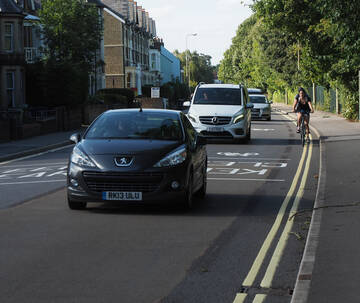 the blacked-out old cycle lane can be seen